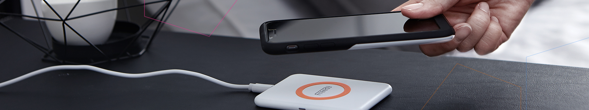 A phone charging on a Freedy wireless charging pad